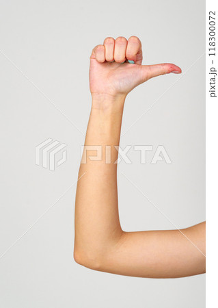 Womans Hand With Blue Nail Polish on gray background. 118300072