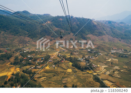 Enjoy breathtaking views from a cable car, overlooking rice terraces and a charming village 118300240