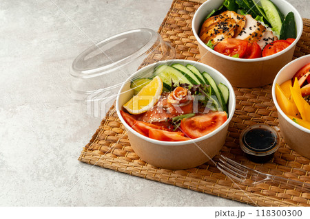 Fresh poke bowl on straw mat close up 118300300