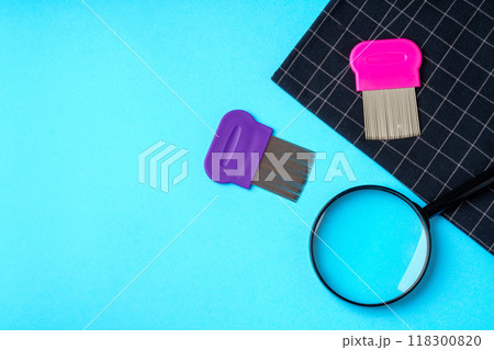 Anti lice equipment on blue background top view Anti lice equipment on blue background top view 118300820