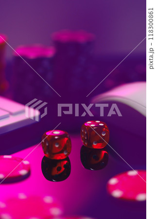 Red Dice on a Pink Surface With a Computer Keyboard and Mouse Red Dice on a Pink Surface With a Computer Keyboard and Mouse 118300861
