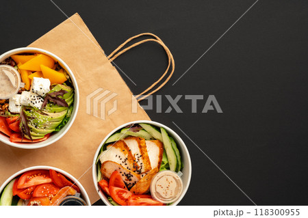 Side view of fresh poke bowls on black background 118300955