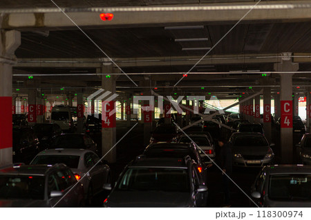Neon multi-level underground parking in a shopping center. 118300974