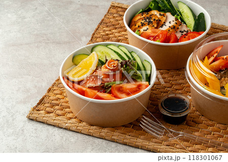 Fresh poke bowl on straw mat close up 118301067