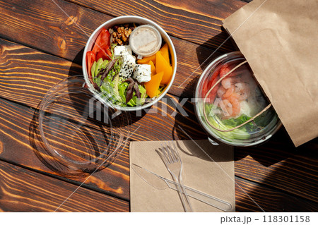 Take out poke bowl on wooden background 118301158