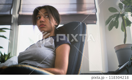 Frustrated African American teenage girl with napkin talks about family problems on therapy session Frustrated African American teenage girl with napkin talks about family problems on therapy session 118304218