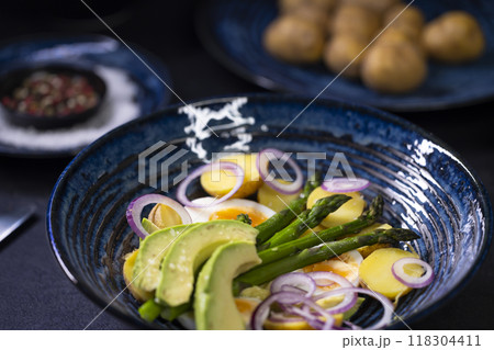 Potato salad with avocado, green asparagus and eggs 118304411