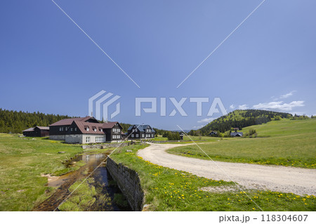 Spring landscape with Jizerka near Korenov, Northern Bohemia, Czech Republic 118304607