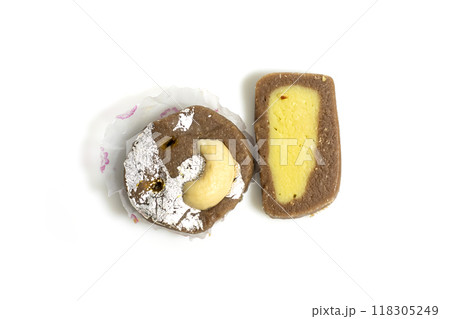 Indian sweets made from milk during festive event on a white surface. Indian sweets made from milk during festive event on a white surface. 118305249