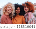 Three joyful women sharing a connected moment, radiant smiles 118310041