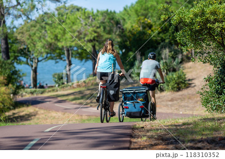 Person riding a bicycle on a cycle path 118310352