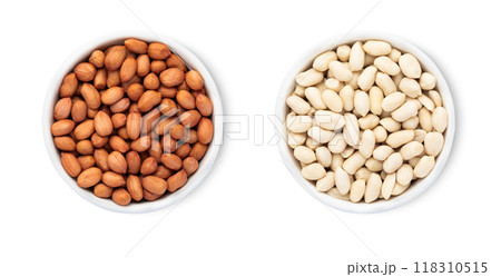 Bowls with red and white peanuts nuts isolated on white background.Top view. Bowls with red and white peanuts nuts isolated on white background.Top view. 118310515