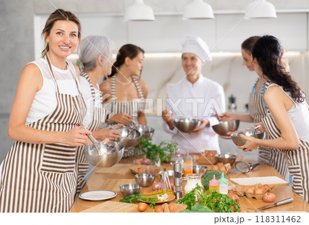 Young woman holding bowl in her hands 118311462