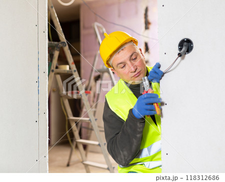 Electrician working with wires in apartment Electrician working with wires in apartment 118312686