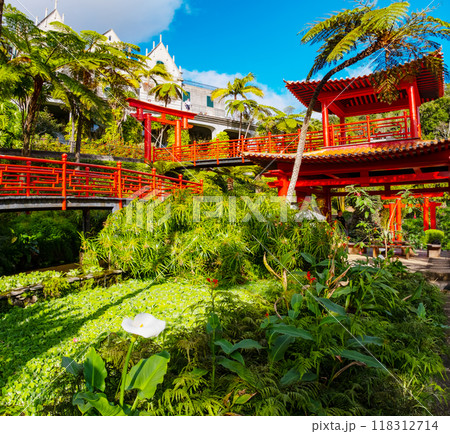Monte Palace tropical garden with red pagoda, lakes and traditional buildings above the city of Funchal, popular tourist destination in Madeira island, Portugal Monte Palace tropical garden with red pagoda, lakes and traditional buildings above the city of Funchal, popular tourist destination in Madeira island, Portugal 118312714