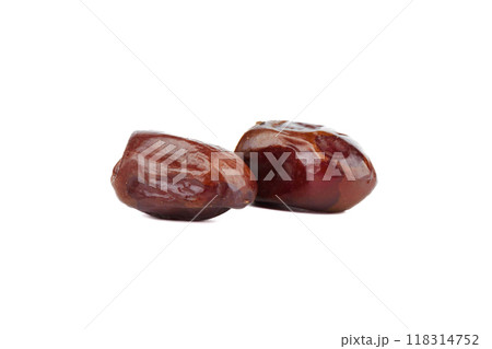 Two dried fruits dates in a wooden bowl and on a white background. 118314752