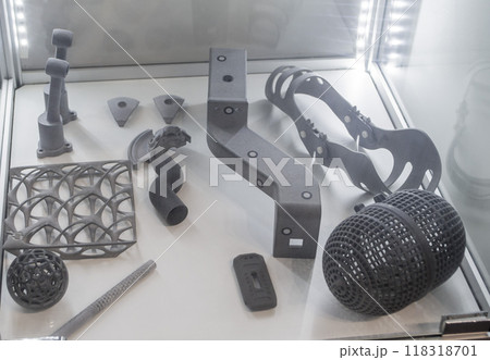Various objects printed on a 3D printer from molten plastic powder. Different models printed on 3D printer from melted grey polyamide powder. New additive 3D printing Multi Jet Fusion MJF technology 118318701