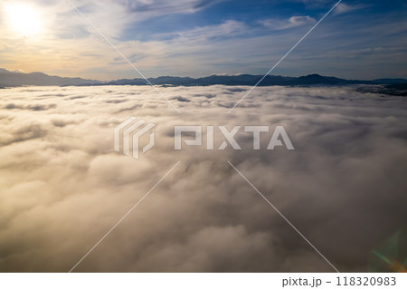 Amazing Sunrise or sunset over mountains hills covered with mist, Aerial view landscape drone shot beautiful colorful nature background 118320983