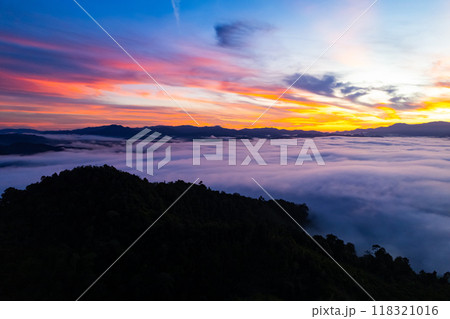 Amazing Sunrise or sunset over mountains hills covered with mist, Aerial view landscape drone shot beautiful colorful nature background 118321016