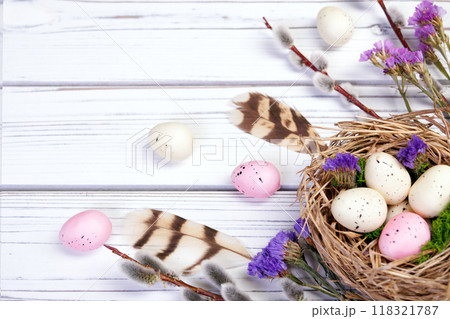 Easter banner with nest, eggs, willow, flowers and feathers. 118321787