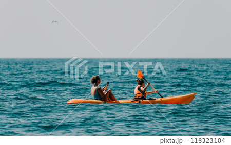 Two Women Kayaking on a Sunny Day Two Women Kayaking on a Sunny Day 118323104