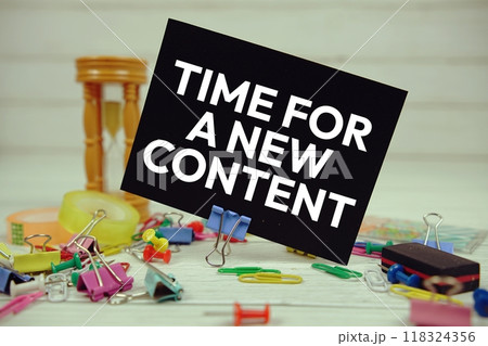 Time For A New Content text on paper card with stationary on wooden background 118324356