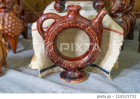 Ukrainian dishes. Wine bottle. Kumanets Kalach - a decanter with a hole in the middle. Clay ceramics. Old decor. Ukrainian dishes. Wine bottle. Kumanets Kalach - a decanter with a hole in the middle. Clay ceramics. Old decor. 118325732