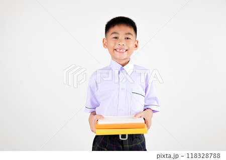 Portrait smile Asian little boy primary posing hand holding book studio isolated white background, happy cute man kid wear school uniform plaid, back to school concept 118328788