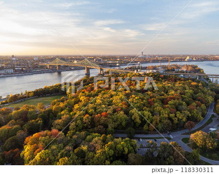 Aerial view of Jean-Drapeau Park, Saint Helen's Island in autumn sunset time. St. Lawrence River, Jacques Cartier Bridge in the background. Montreal, Quebec, Canada. Aerial view of Jean-Drapeau Park, Saint Helen's Island in autumn sunset time. St. Lawrence River, Jacques Cartier Bridge in the background. Montreal, Quebec, Canada. 118330311