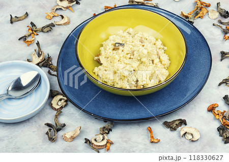 Tasty millet porridge with roasted mushrooms. 118330627