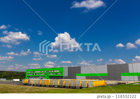 Distribution warehouse with trucks of different capacity. 118332122