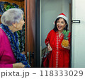 Combating Loneliness at Christmas: Social Worker's Festive Approach Brings Joy to Elderly Woman's Home. 118333029