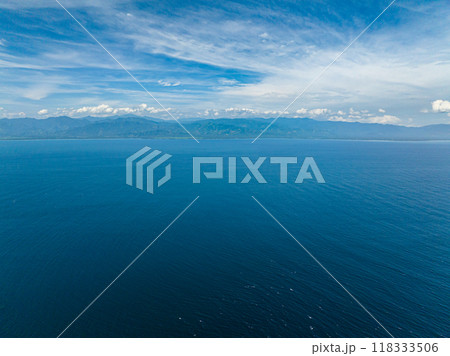Blue sea with waves and blue sky with cloud, aerial view. Davao, Philippines. 118333506