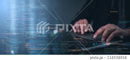 Hands typing on laptop with programming code on screen, representing software development. Perfect for coding, IT solutions, digital technology, web applications. 118338938