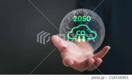 Hand holding globe with carbon reduction symbols and 2050 target, promoting sustainability. Ideal for environmental policies, green energy initiatives, climate change solutions. Hand holding globe with carbon reduction symbols and 2050 target, promoting sustainability. Ideal for environmental policies, green energy initiatives, climate change solutions. 118338961