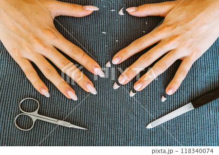 women's hands with manicure, one hand with trimmed nails women's hands with manicure, one hand with trimmed nails 118340074