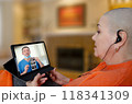 Patient receives breast cancer consultation via tablet as doctor explains ultrasound results remotely, illustrating modern healthcare communication. 118341309