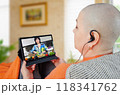 Digital age empowers cancer patients: person accesses nutritional expertise through video, illustrating comprehensive care approach. 118341762