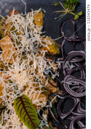 Gourmet Vegetable Stir Fry with Grated Cheese and Fresh Onions on Dark Plate Gourmet Vegetable Stir Fry with Grated Cheese and Fresh Onions on Dark Plate 118343474