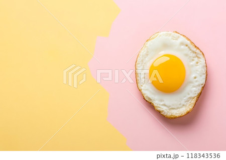 Fried egg beautifully displayed against vibrant and colorful background 118343536