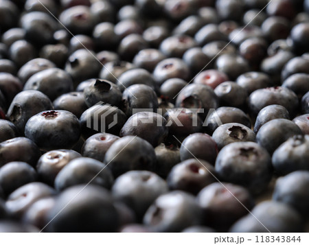 Fresh blueberries are scattered on a surface Fresh blueberries are scattered on a surface 118343844