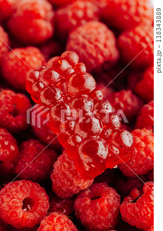 Natural raspberry marmalade on fresh raspberries, showcasing vibrant red colors and unique texture Natural raspberry marmalade on fresh raspberries, showcasing vibrant red colors and unique texture 118343889