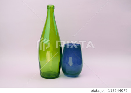 Colorful glass bottle and empty glass background 118344073