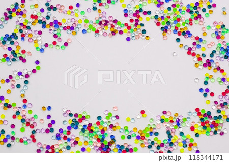 Multicolored tiny faceted crystals on a white background, beautiful colorful texture Multicolored tiny faceted crystals on a white background, beautiful colorful texture 118344171