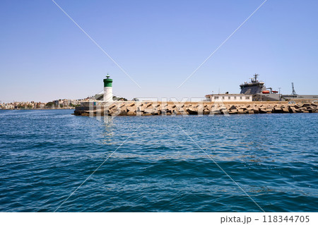 Lighthouse next to the port. Lighthouse next to the port. 118344705