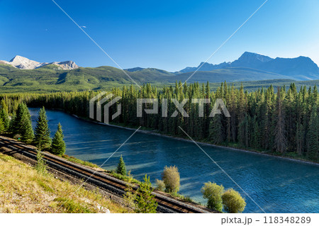Bow River flows through forest and railway track. Storm Mountain in the background. Castle Cliff Viewpoint, Bow Valley Parkway, Banff National Park, Canadian Rockies, Alberta, Canada. 118348289