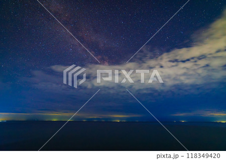 starry night sky over large mountain lake at night starry night sky over large mountain lake at night 118349420