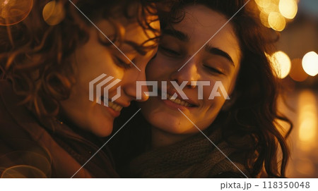 Close-Up of Two Friends Sharing Joyful Moment in Warm Lighting with Copy Space Close-Up of Two Friends Sharing Joyful Moment in Warm Lighting with Copy Space 118350048