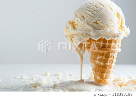 Melting Vanilla Ice Cream Cone with Creamy Trail on Textured Surface 118350188