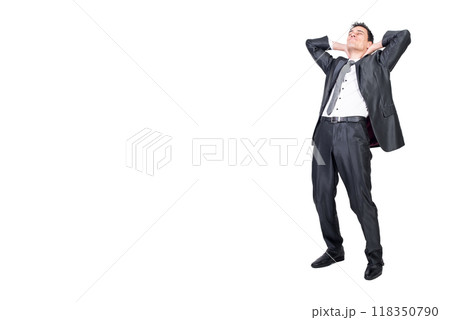Relaxed man in formal wear standing with hands behind head 118350790